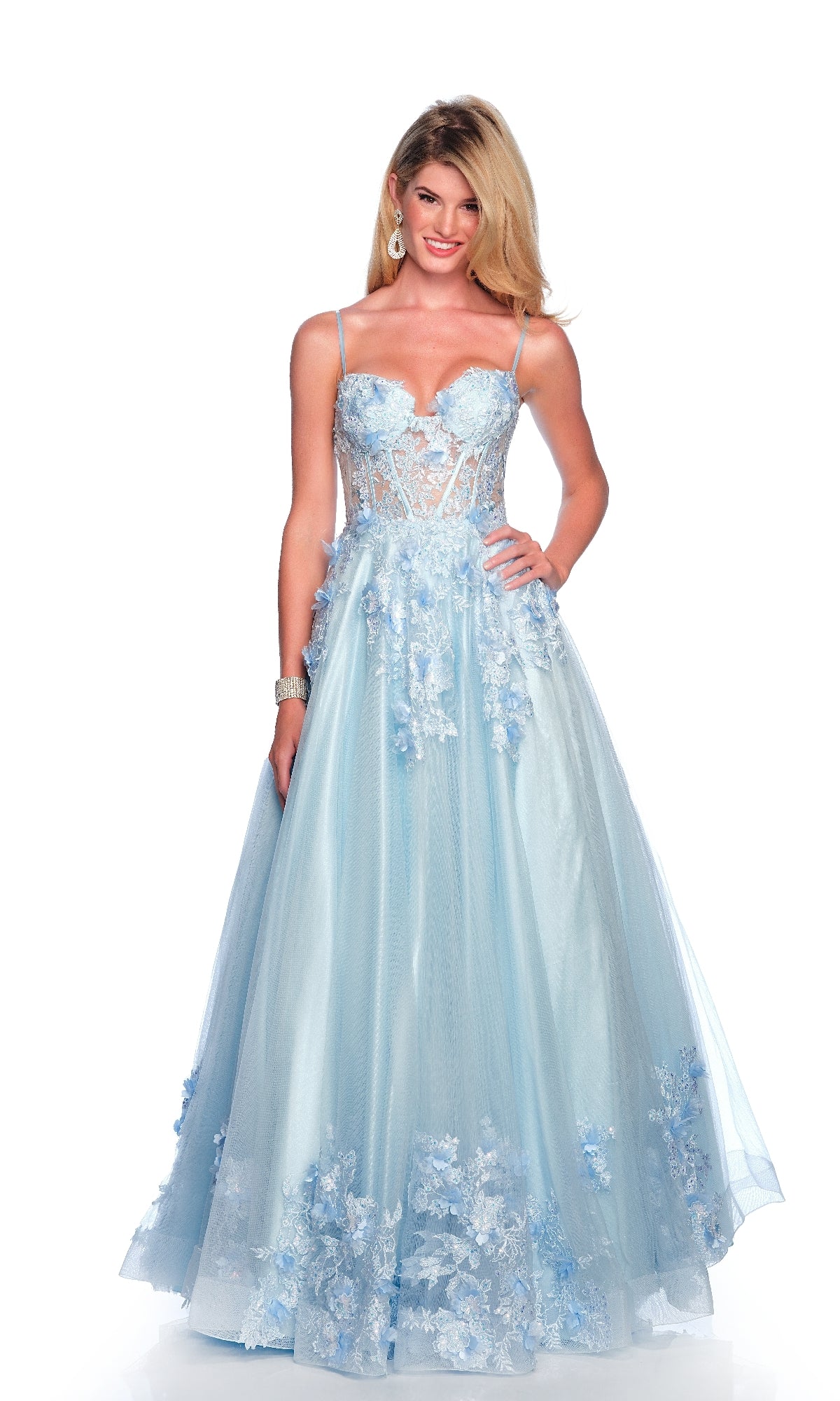 Woman wearing the Dave & Johnny 11801 long light blue prom dress, featuring a lace corset bodice and 3D flower accents, standing and smiling against a white background.